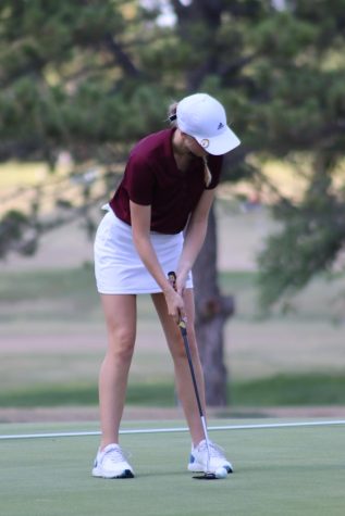 Senior Katie Dinkel putts at the Smoky Hill Country Club at the Hays High Invitational Tournament. She shot an 83 at this meet.