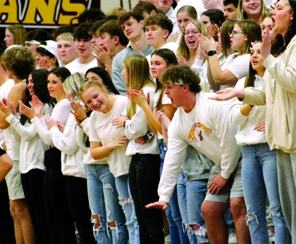 Crowd of Hays High students show their pride at a boys basketball game against our rivals, Great Bend. This has been a long standing tradition of students to wear white when playing this team.