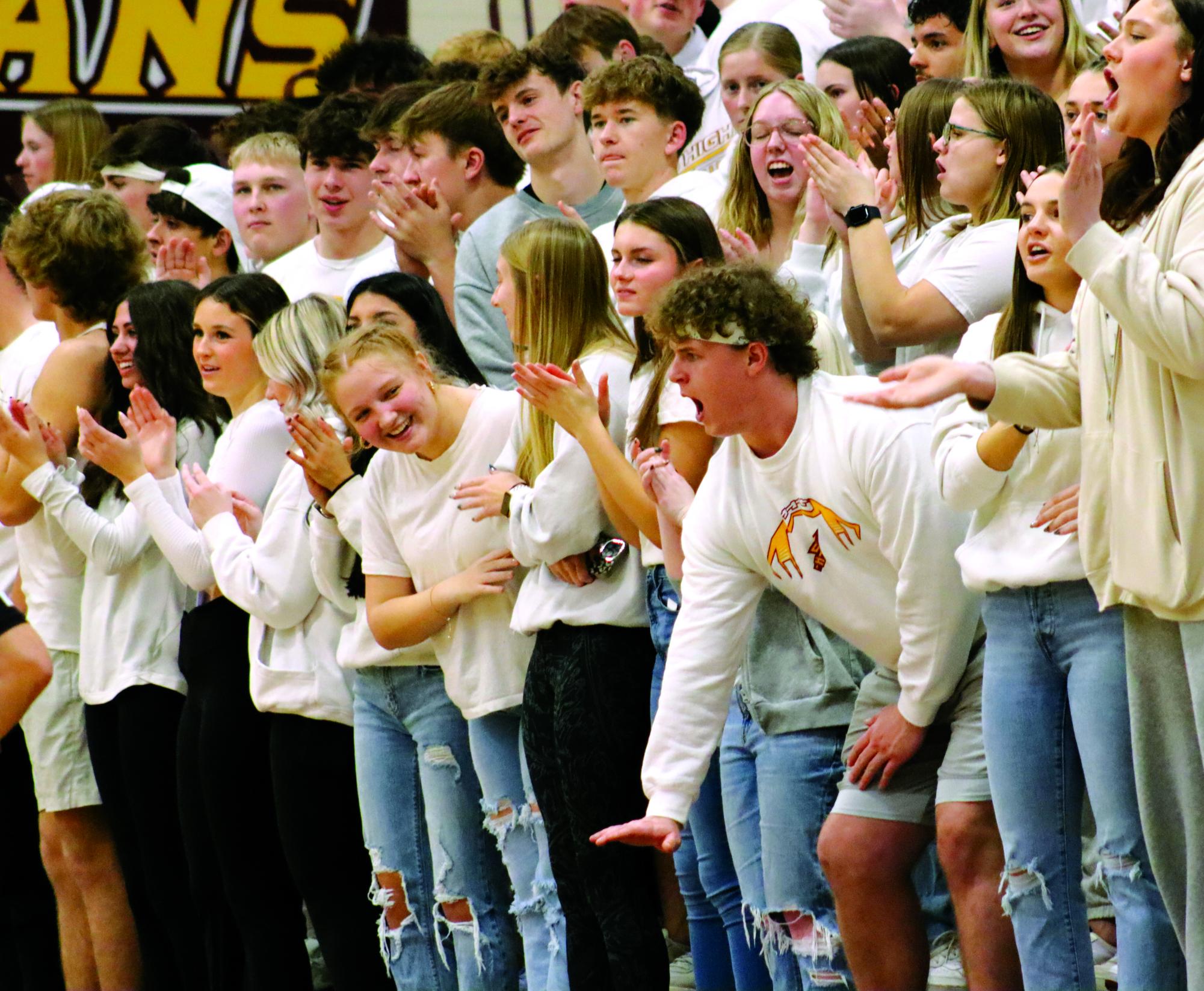 Crowd of Hays High students show their pride at a boys basketball game against our rivals, Great Bend. This has been a long standing tradition of students to wear white when playing this team.