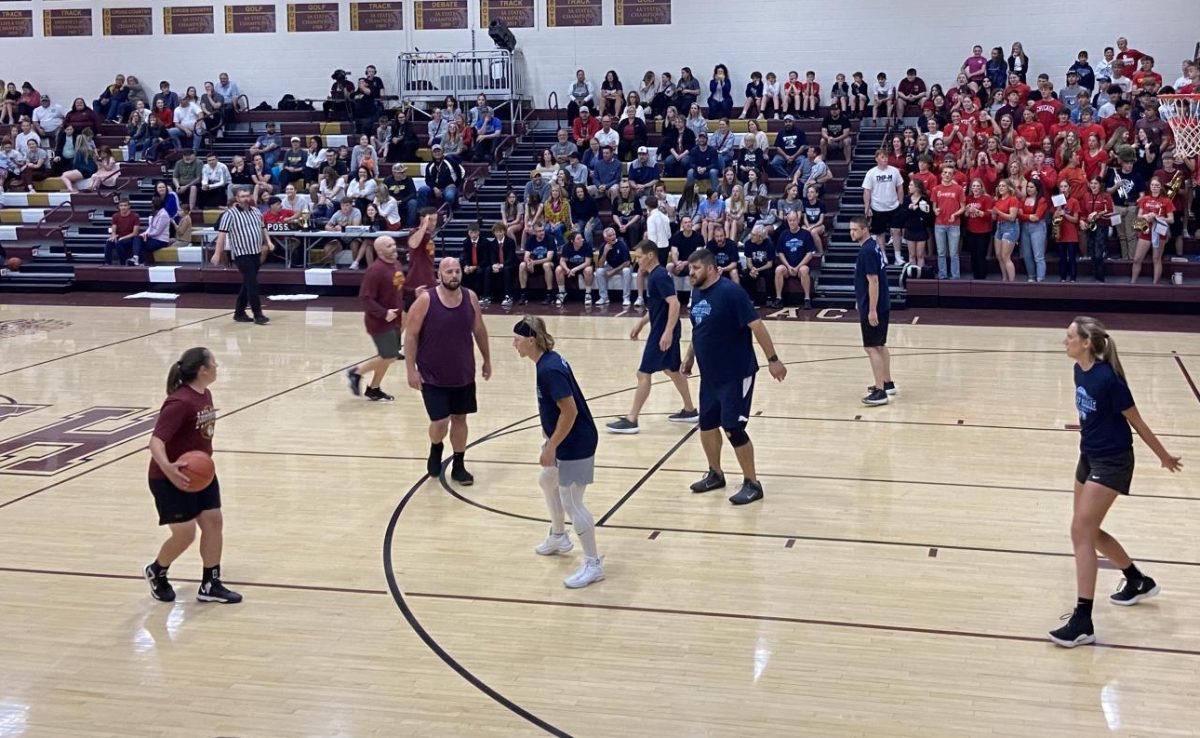 Hays High staff plays against TMP staff in charity basketball game