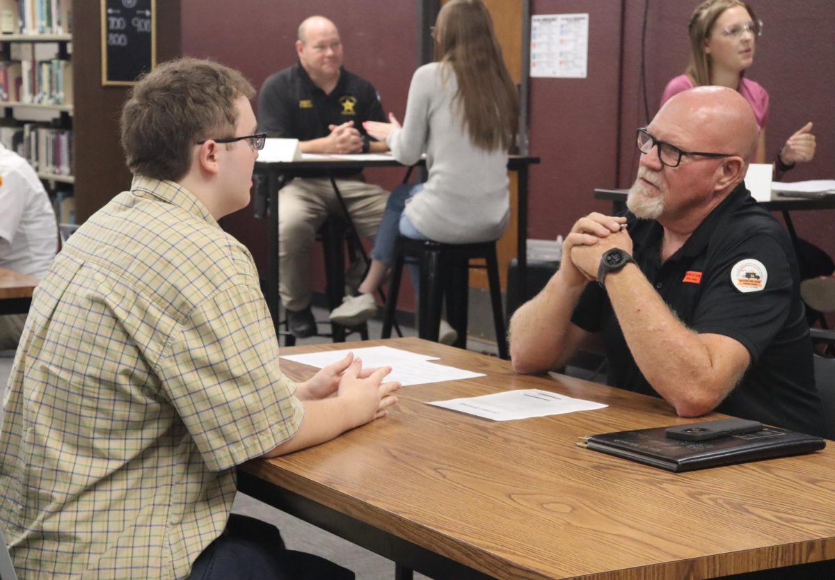 Senior Jordan Breinig participates in mock interviews during G2 English on Sept. 12 in the Hays High School library.