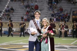 Homecoming king Cooper L. Johnson and queen Dani Willeford smile after being crowned.