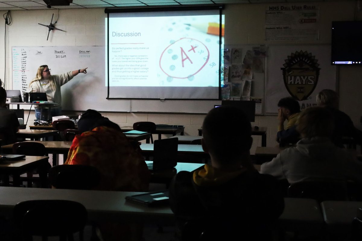 During a Freshman Success Seminar on Oct. 17, GPS instructor Lauren Stallbaumer gives students instructions for their discussion after watching a video. Students use the first 15 minutes of Freshman Success Seminar for lessons to help them succeed at Hays High School.