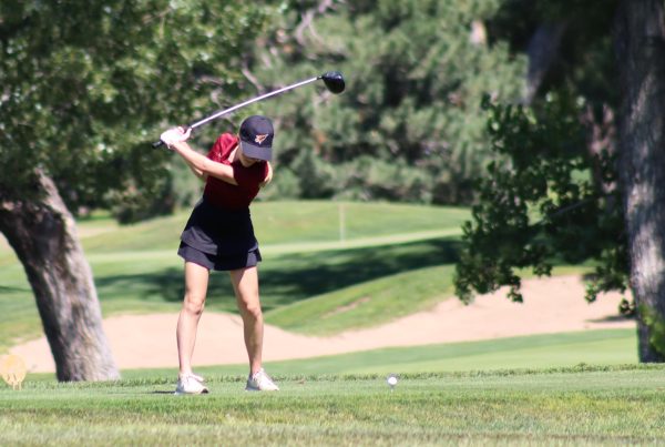 Junior Ava Erbert takes a swing at a golf tournament in Hays at the Smokey Hill golf course.