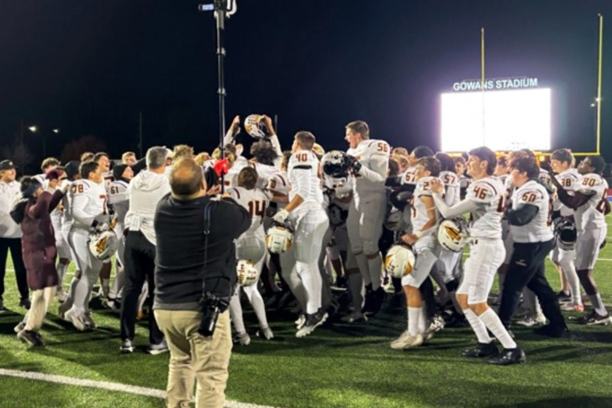 The Hays High football team celebrates after defeating Hutchinson in the sectional round of the state playoffs.