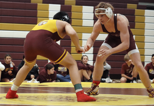 Roberto Macias prepares to wrestle his opponent at the Hays vs Salina Central Duel on Dec. 12.