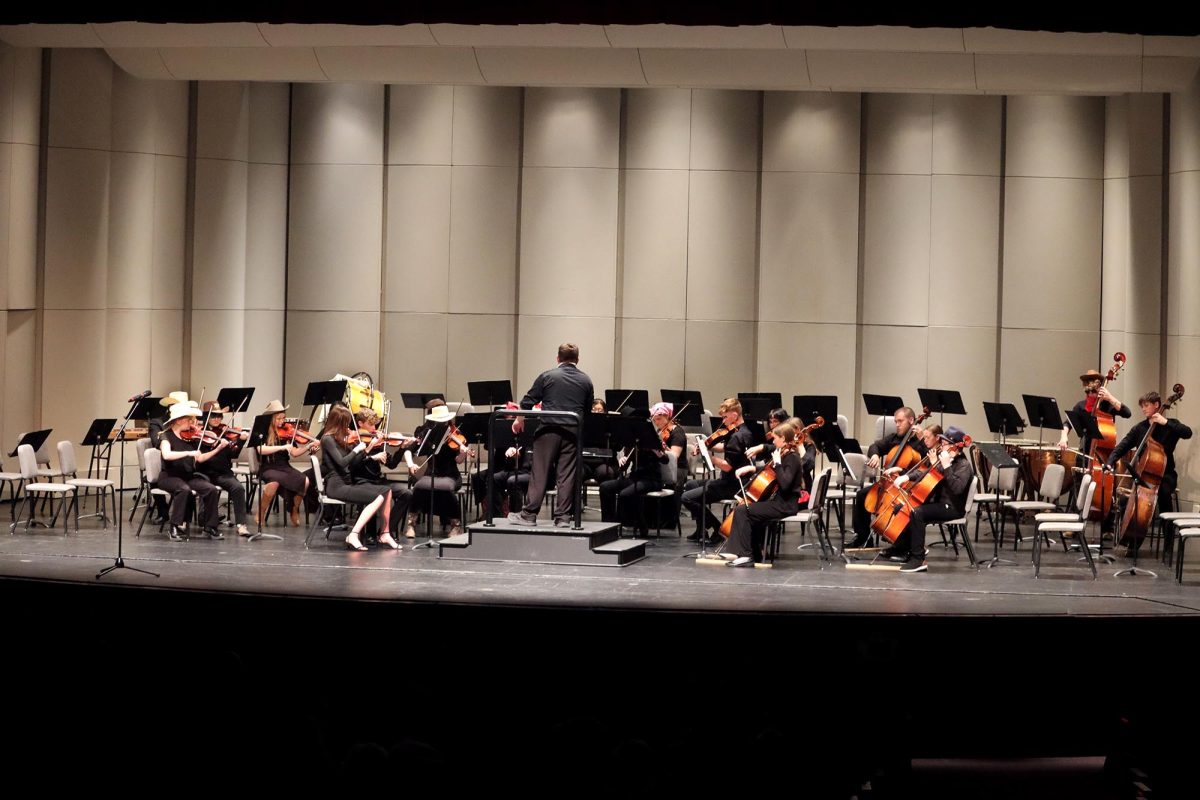 Hays High orchestra students perform earlier this year in the Go West concert.