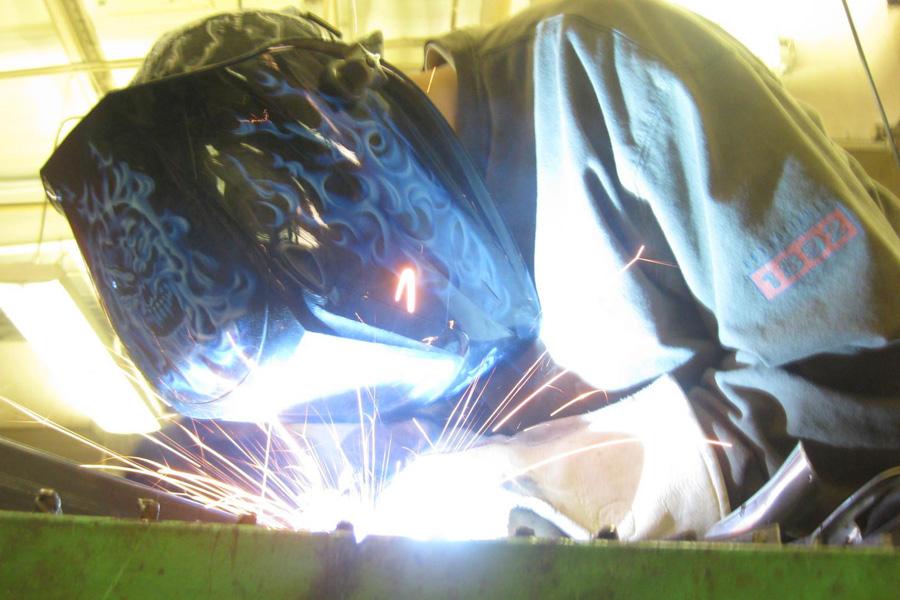 Senior Clayton Schneider works on a welding project. 
