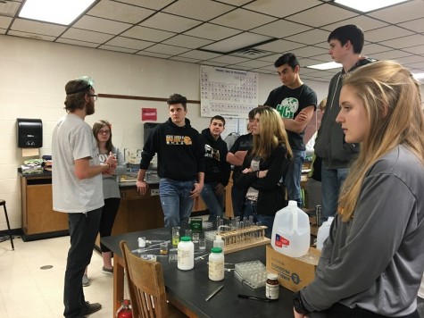 Junior Chemistry class performs chemical reaction experiments
