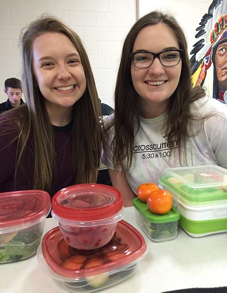 Guidon staff members Basso and Brooks bring lunches