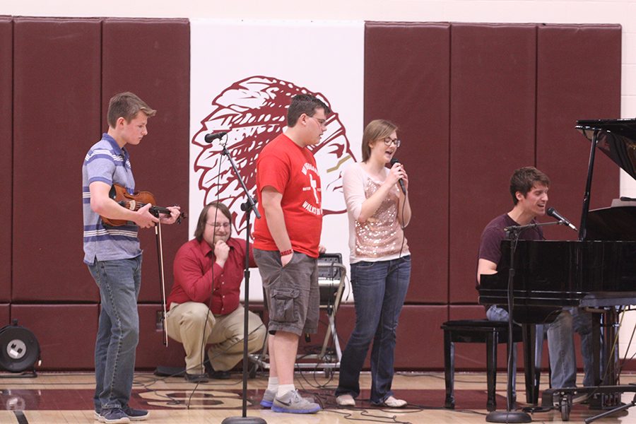 Seniors+Caleb+Pfeifer+and+Elizabeth+Arthur+and+juniors+Eric+Rorstrom+and+Mason+Wellbrock+sang+their+version+of+Hallelujah+at+the+talent+show.
