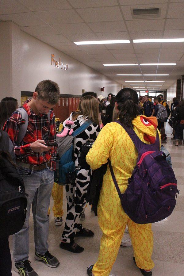Students gather in the freshman hallway before school on Barnyard Buds day.