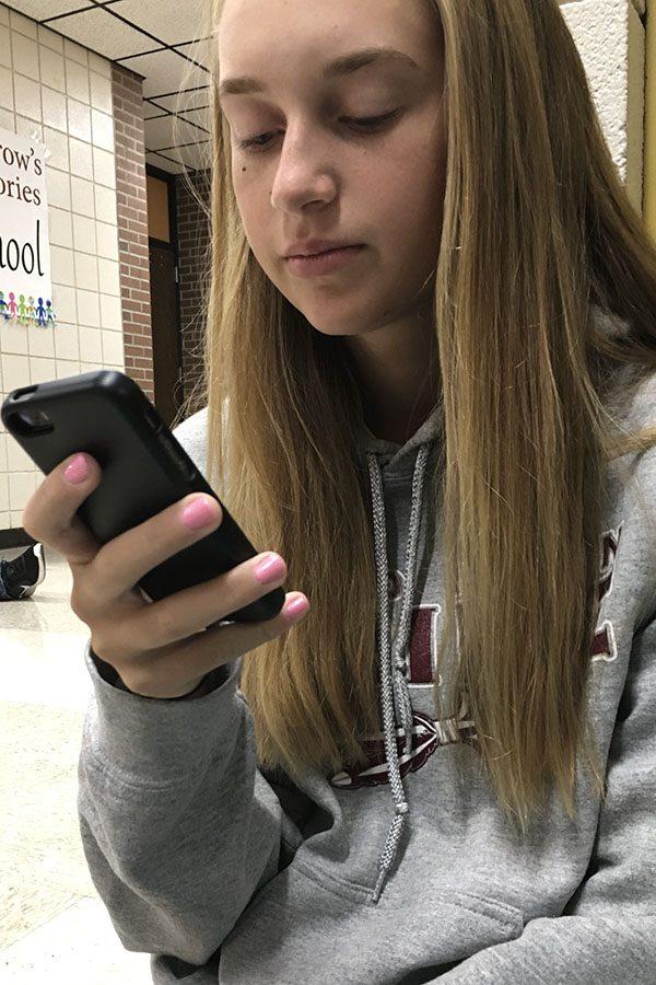 Sophomore Emily George texts with the new features before school starts.