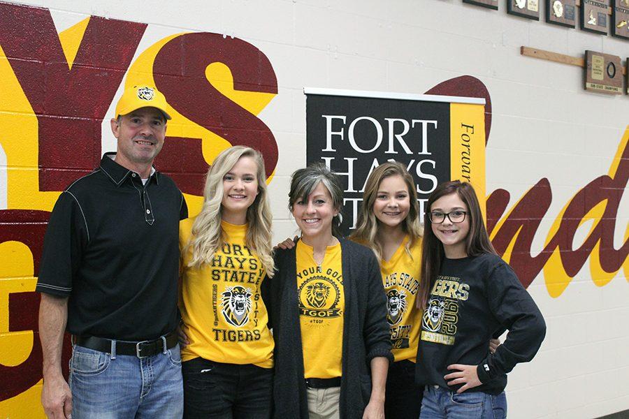 Senior Katie Brungardt poses with family after signing ceremony. 