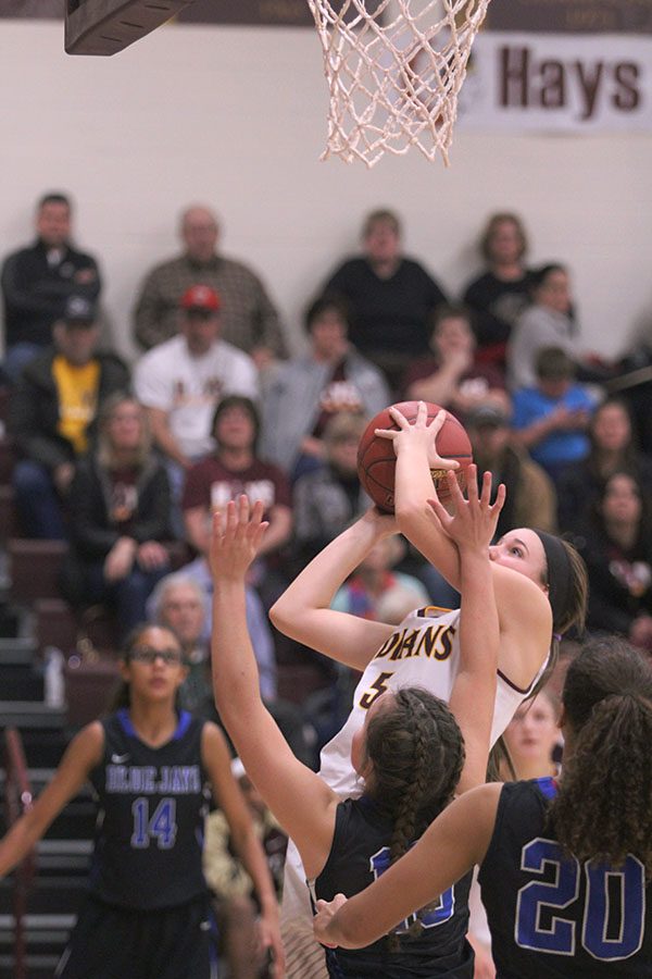 Sophomore Jaycee Dales goes up for a shot on Dec. 13 against the Junction City Blue Jays. Dale had 13 points on the night. 