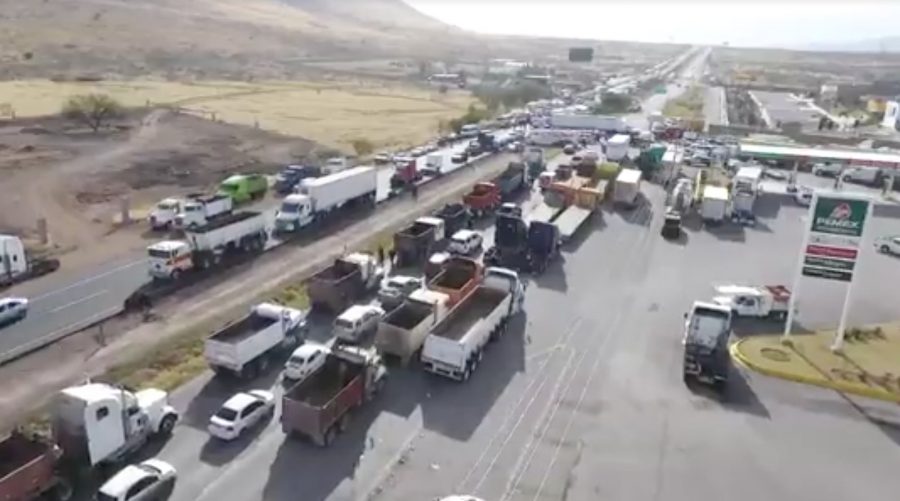 Traffic is stalled on a highway in Chihuahua due to a blockade put in place to protest raised gas prices.