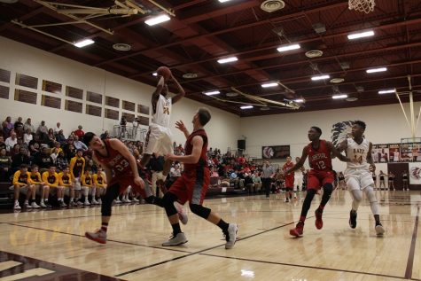 Boys basketball loses to Abilene Cowboys