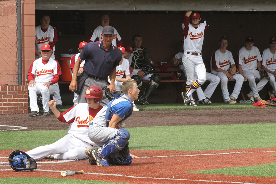 Senior Cole Murphy sliding into home plate during a home game in a previous season.