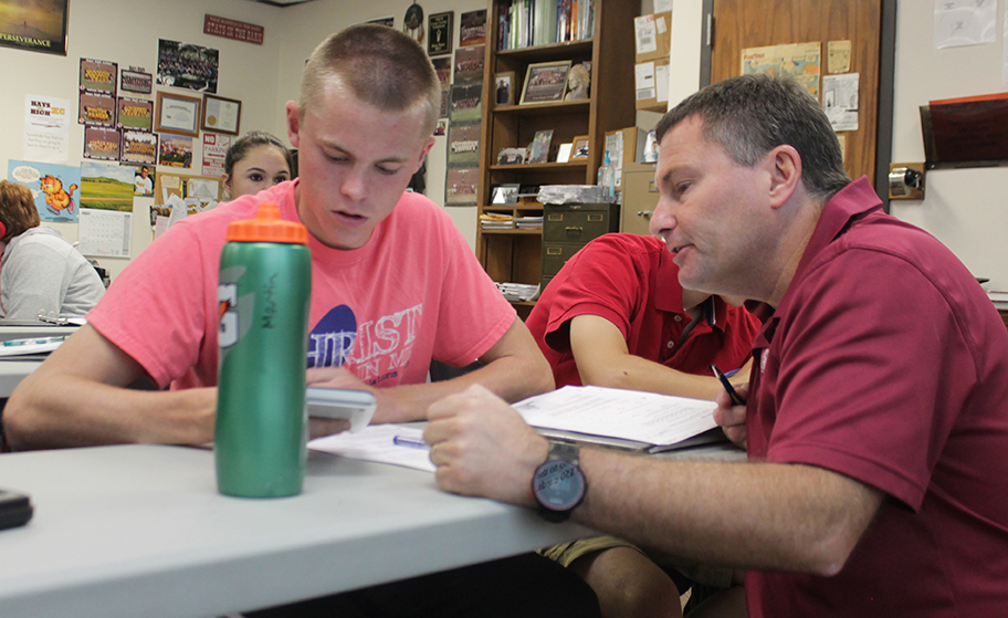Going over the class assignment with junior William Staab is Instructor Jerald Harris. Harris is a math teacher who teaches Adv. Algebra I, Adv. Algebra II and Calculus. “My day consisted of teaching and helping students,” Harris said. “Even when it was my plan I had students in my room needing help.”
