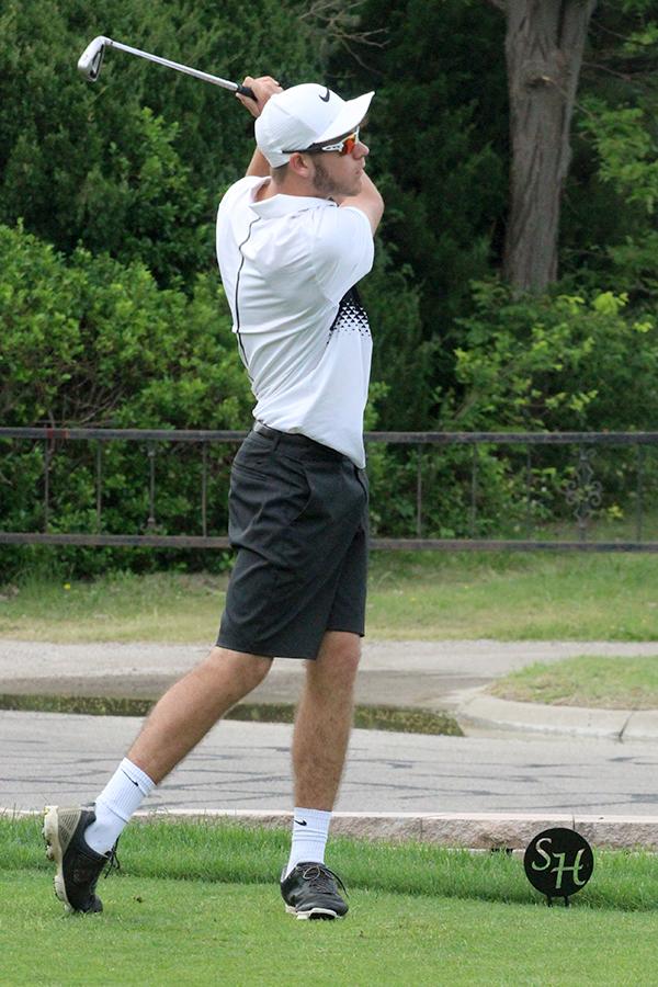 Senior Justin McCullick tees off at the Class 4A Regional Golf Tournament in Hays. McCullick finished with a 17th-place medal at the state tournament on May 22.