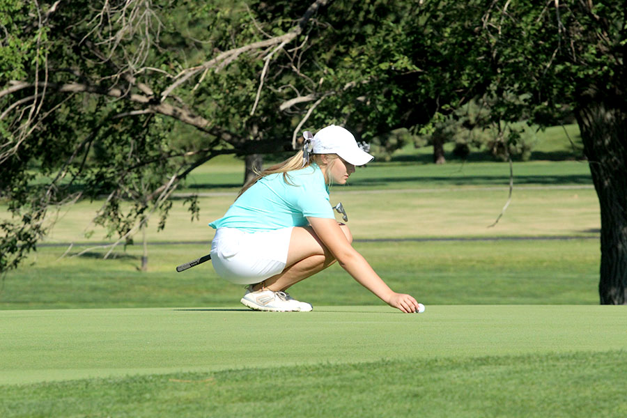 Junior Brittani Park lines up on the green at the Lady Indians season opener at home. 