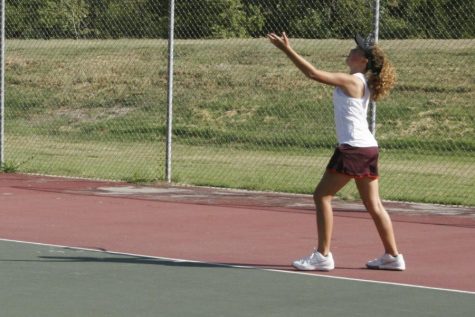 Girls tennis plays at home