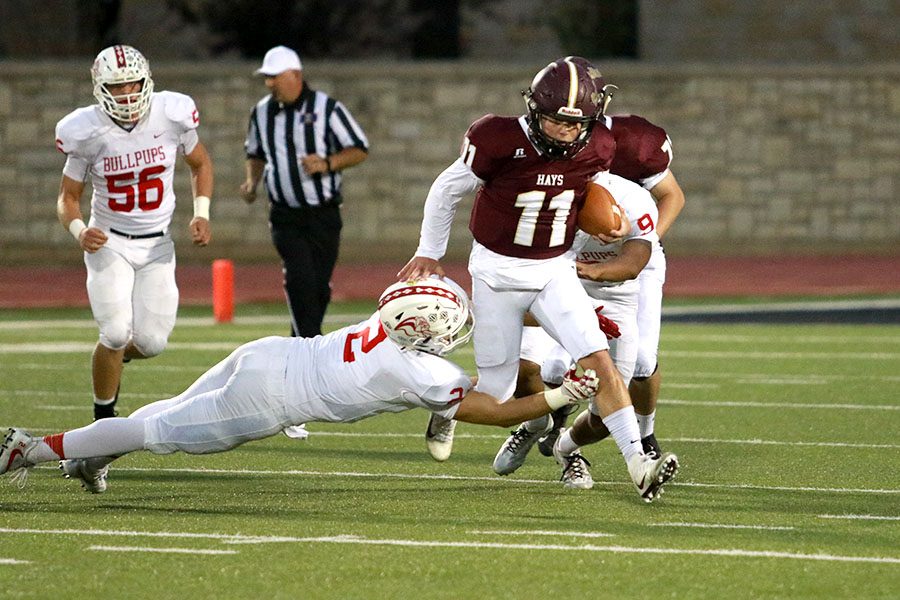Senior Hunter Brown runs past a defender on Oct. 13 against the McPherson Bullpups. The Indians lost 48-6.