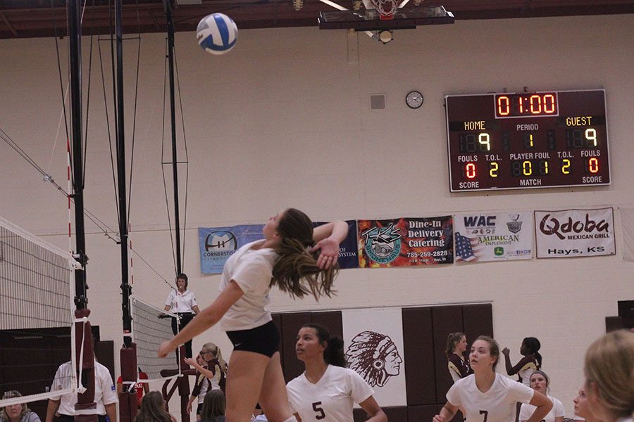 Junior Jaycee Dale goes for a kill at a home for the Hays Quad