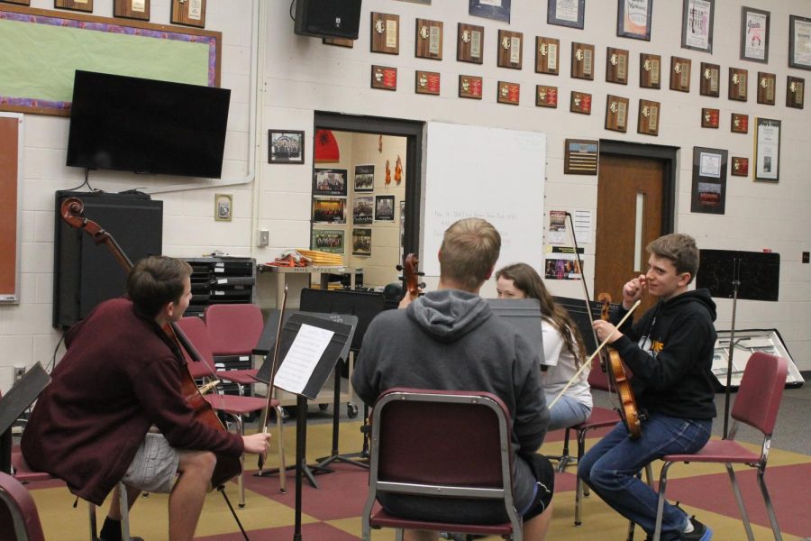 The quartet begins practice for their upcoming concert.