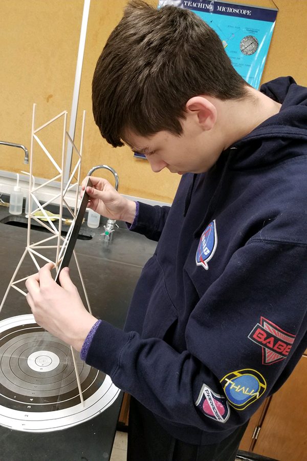 Senior Ashton Balthazor makes sure the measurements are correct on the tower for the Goodland competition. Balthazor will compete in three events at Goodland, two of which require the building of an apparatus before competing.