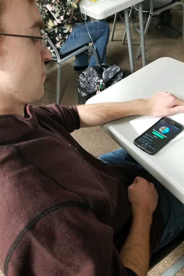 Senior Adam Klausmeyer is seen listening to Sons of the Pioneers on Spotify. Sons of the Pioneers is one of the groups affected by this lawsuit with their song Tumbling Tumbleweeds.