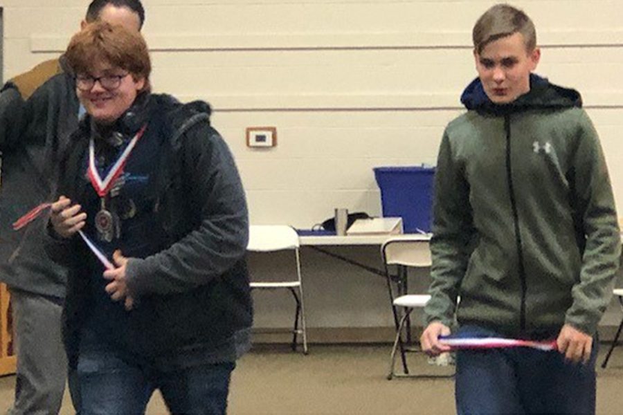 Seniors Eric Adams and Seth Beauchamp recieve a third place medal in material science at the Maverick Shootout. Eric Adams also placed second in Optics at the same competition.