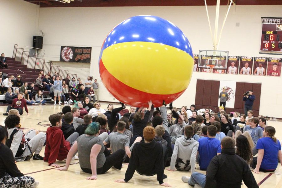 Freshmen compete against seniors in the beach ball competition.  Each class was trying to kick the ball over the other teams free throw line.