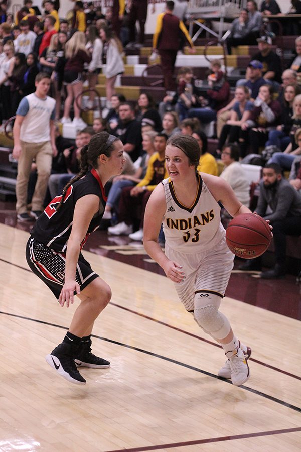 Sophomore Brooke Denning drives into the lane for a shot in a recent game against the Great Bend Panthers. On Feb 13, the Indians pulled off a win over the Abilene Cowgirls, 57-37.