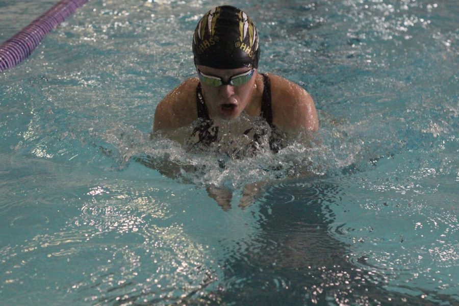 Sophomore+Megan+Flavin+swimming+the+breastroke+during+her+200+IM.+She+placed+4th+overall.