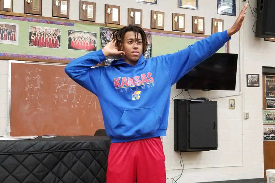 Senior Tay Otte poses for a picture demonstrating one of the dance moves he taught concert choir. This particular move he taught to the tenor and bass sections. Tay Otte currently plans to attend the University of Kansas after high school with an emphasis in biology.