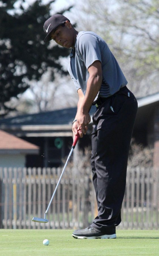 Junior Trey McCrae squares up on the green in a recent tournament at home. On May 14, McCrae won his sixth tournament of the season. 