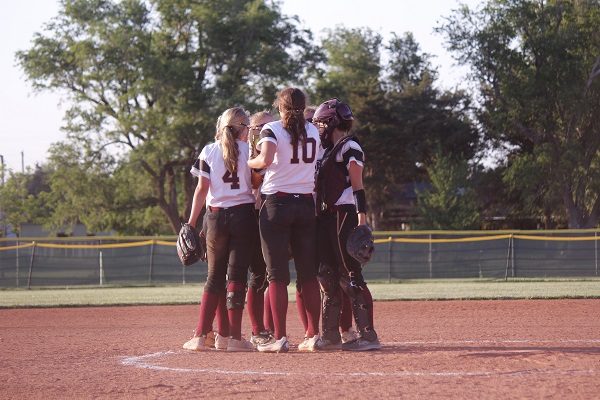 The Lady Indian infielders breaking it down, before the inning. 