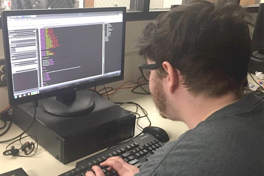 Senior Tyler Rodgers begins coding in class