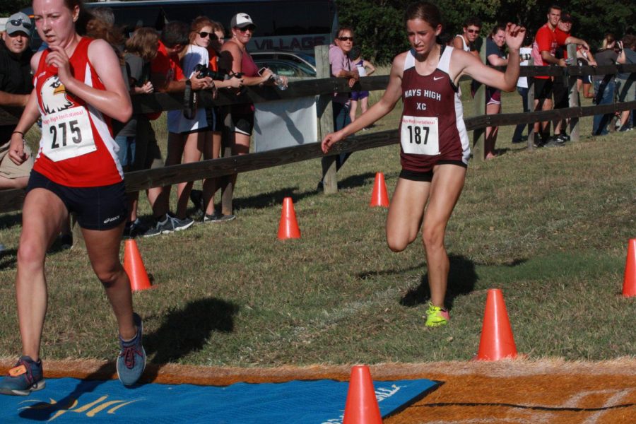 Sophomore Allison Shubert reaches the finish at the Hays Invitational. 