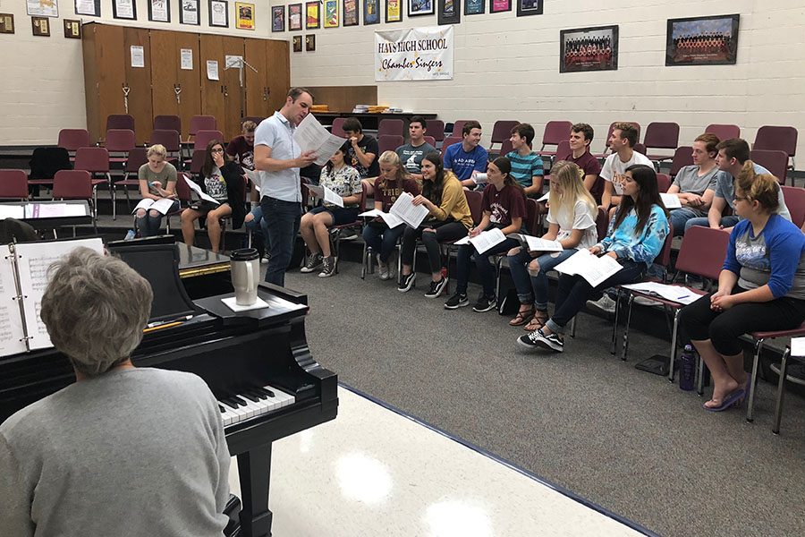 Vocal Director Alex Underwood explaining one of the KMEA pieces during Chamber Singer practice.