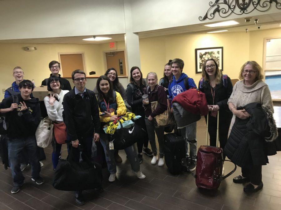 The debate team poses at their hotel in Lawrence. The novices competed at their first open tournament this season.
