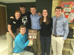 The Scholars Bowl team posing with their award after winning runner-up at Regionals.