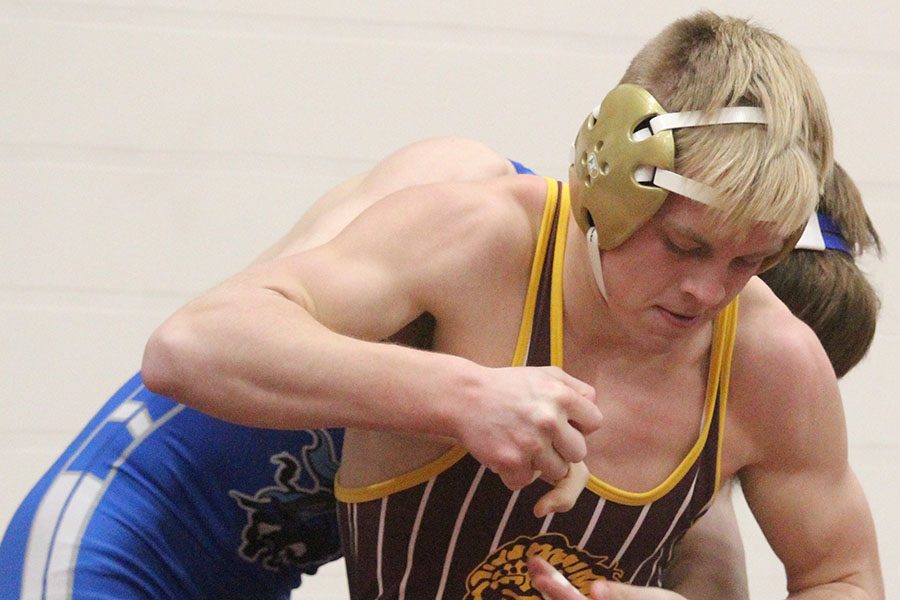 Senior Creighton Newell, trying to break away from his opponent at Bob Kuhn. 