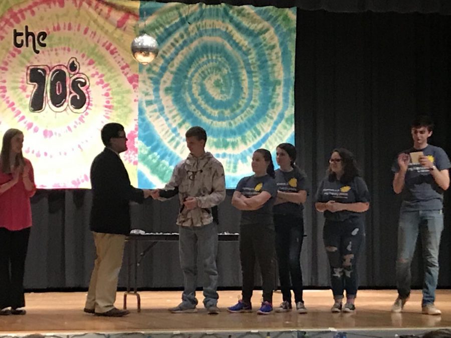 Forensic team members that placed received their awards on stage at Ellis High School. Both forensic meets were on March 2.   