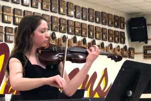 Senior Alex Hagerman plays her contest solo, Kol Nidrei by Max Bruch, during this years Ice Cream Concert. Hagerman is one of five seniors in Orchestra. 