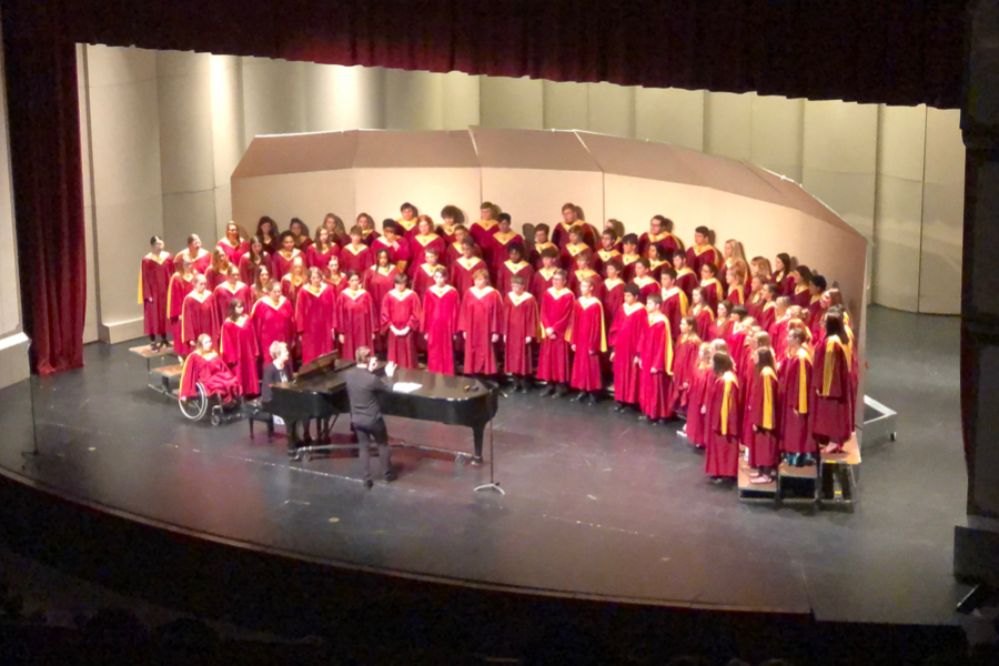 Vocal director Alex Underwood conducts Concert Choir during the finale of the Spring for Music Festival. Freshman Samantha Vesper soloed in Home On The Range.