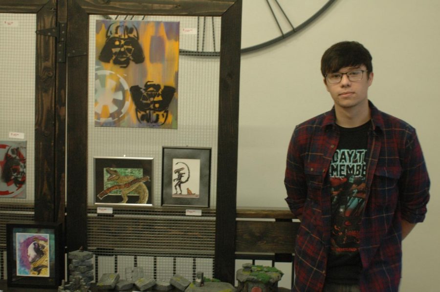 Former Hays High Student Korbyn Olson displays his work at the Fall Art Walk held Aug. 23 in Downtown Hays. 