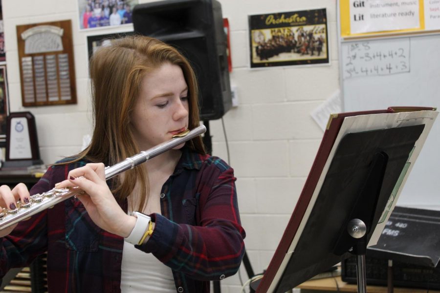 During PRIDE Time, senior Paige Beamer practices the KMEA District Band music in the band room. Beamer received second chair in the flute section for KMEA.