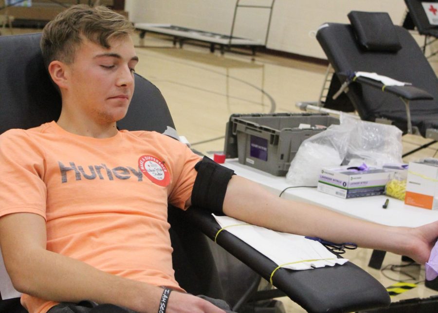 Senior Nathan Erbert donates blood at the Red Cross Blood Drive on Nov. 12.